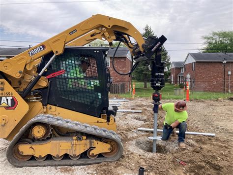 drilling piers with skid steer|helical pier equipment.